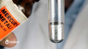 Mercury water testing. Test tube with mercury metal for water quality analysis.