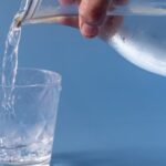 Water being poured into a glass. Clean drinking water for health. Lead in water concept.