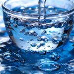 Distilled water in glass. Can distilled water go bad? Pure, clean drinking water concept.