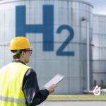 Hydrogen water concept. Engineer inspecting H2 storage tanks. Breakthrough or trend?