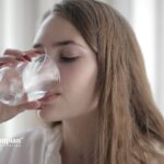 Woman drinking water. Is tap water in Utah safe? Test your water quality.