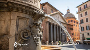 Rome tap water fountain. Ancient fountain with fresh water flowing in Rome, Italy. Is it safe to drink tap water in Rome?