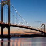 Bronx water quality concerns: Throgs Neck Bridge over calm water at dusk. Water testing.
