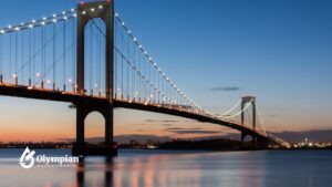 Bronx water quality concerns: Throgs Neck Bridge over calm water at dusk. Water testing.