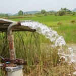 Well water flowing from a pipe. Check your water quality with well water testing in Somerset County.