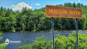 Hudson River sign with trees and water. Water quality in Hudson County.
