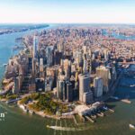 NYC water quality. Aerial view of New York City skyline, waterways, and bridges. Water testing services.