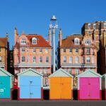 Sussex County water quality: Colorful beach huts and historic buildings under a clear blue sky.