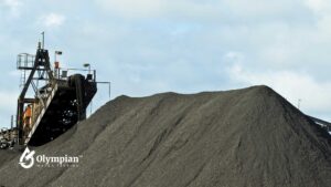 Manganese mining equipment and a large pile of manganese. Well water contamination risk.