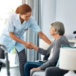 Caregiver assisting senior woman. Long-term effects of lead exposure can require home healthcare.