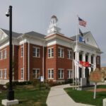 Mercer County, Kentucky. Well water testing for contaminants. Courthouse and flags.