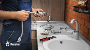 Replacing Fixtures: Plumber with new faucet and plumbing parts. Home well water fixture replacement.